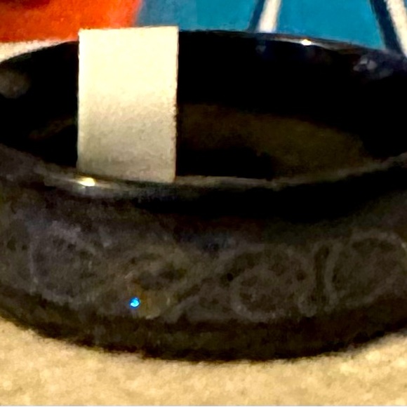 NWOT stainless steal ring w/ blue sparkle inside & black on the outside. Size 11 - Picture 2 of 3